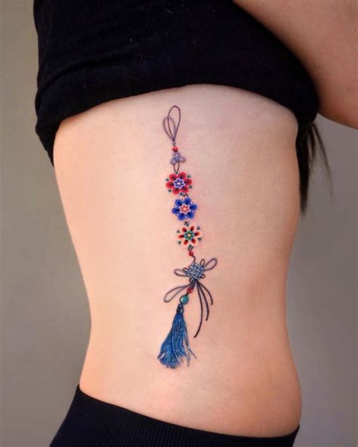 Enchanting Floral Rib Tattoos: A Symphony Of Delicate Designs